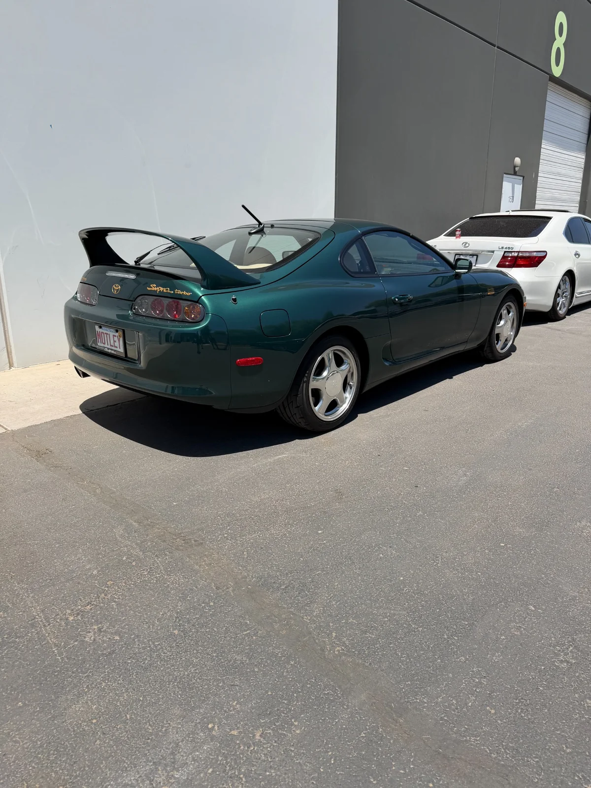 Green Toyota sports car rear view